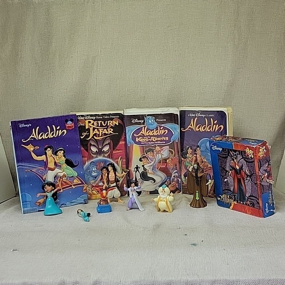Disney Aladdin and Jafar VHS movies, book and puzzle and figures‎
